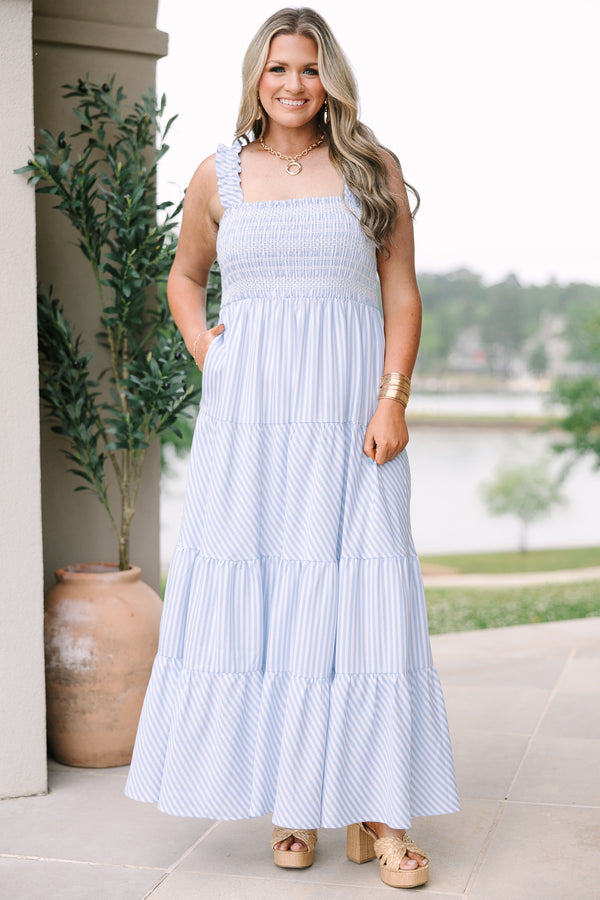 Plus Size blue and white striped maxi dress with a smocked bodice and tiered skirt.