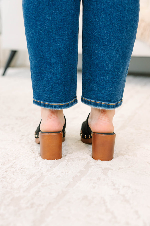 Slip-on, closed-toe block-heel clog featuring a chunky platform base, metal stud details