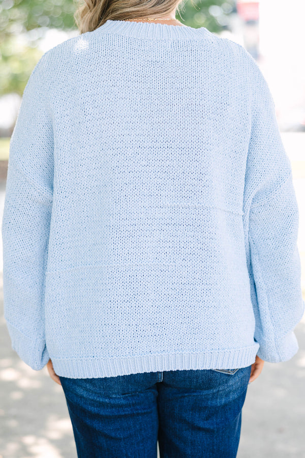 Plus Size light blue oversized knit sweater with a crew neckline and long balloon sleeves.