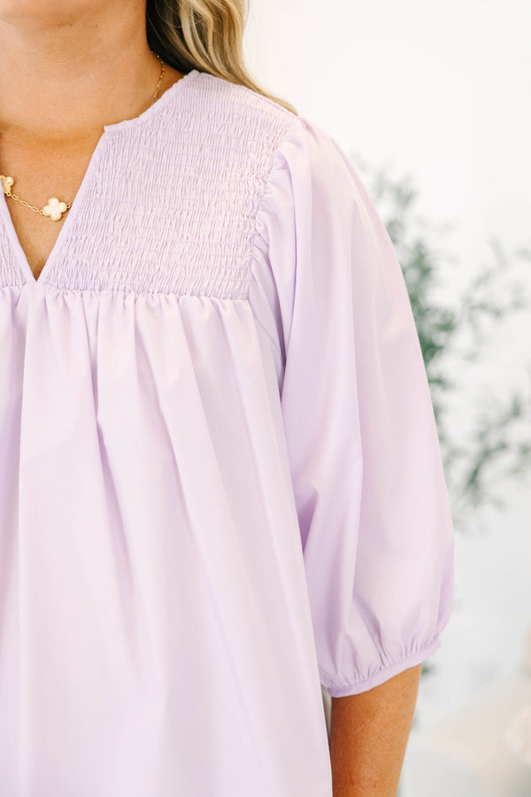 Plus Size lavender top with a split v-neck, smocked yoke, and three-quarter puff sleeves.
