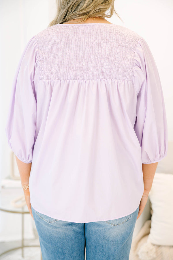 Plus Size lavender top with a split v-neck, smocked yoke, and three-quarter puff sleeves.