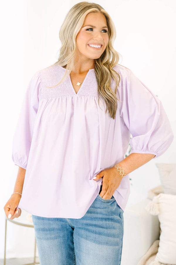Plus Size lavender top with a split v-neck, smocked yoke, and three-quarter puff sleeves.