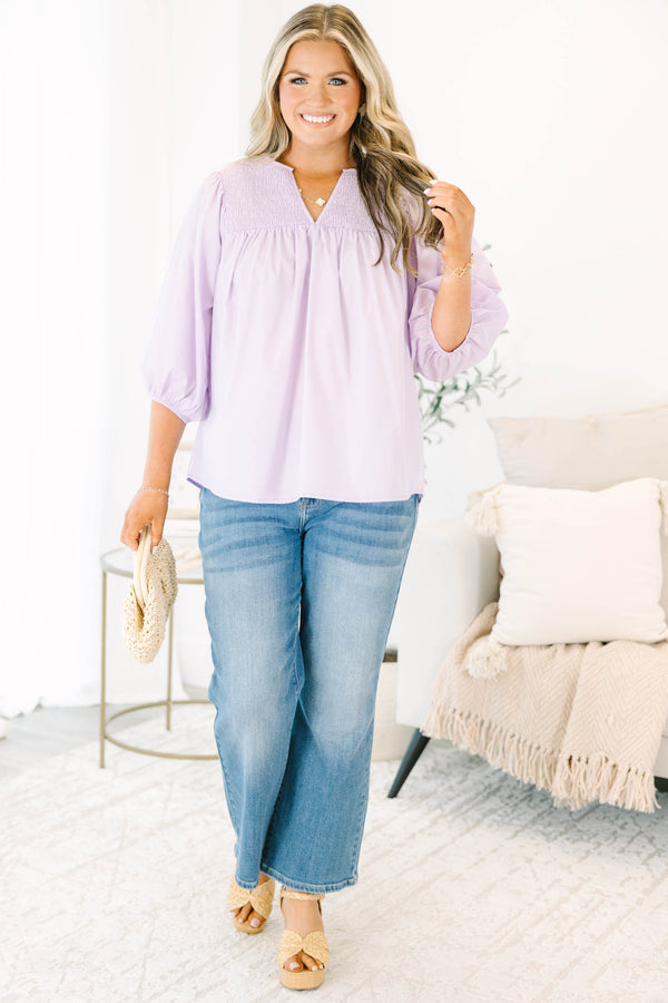 Plus Size lavender top with a split v-neck, smocked yoke, and three-quarter puff sleeves.