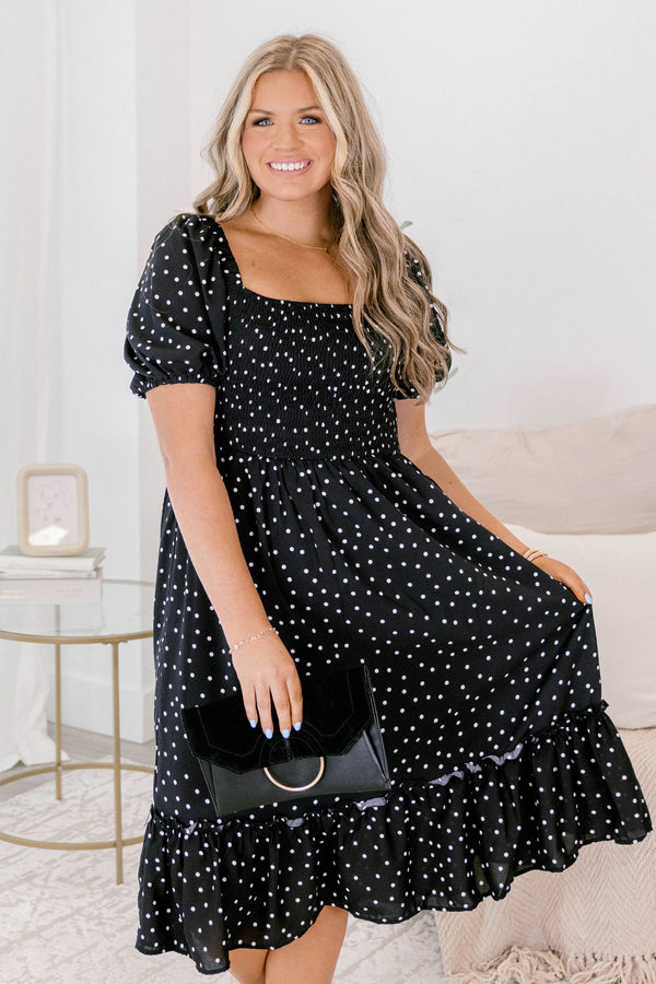 Chic Soul plus size clothing, black polka dot midi dress that has a square neckline and bubble sleeves as well as a ruddle detail on the bottom of the dress 