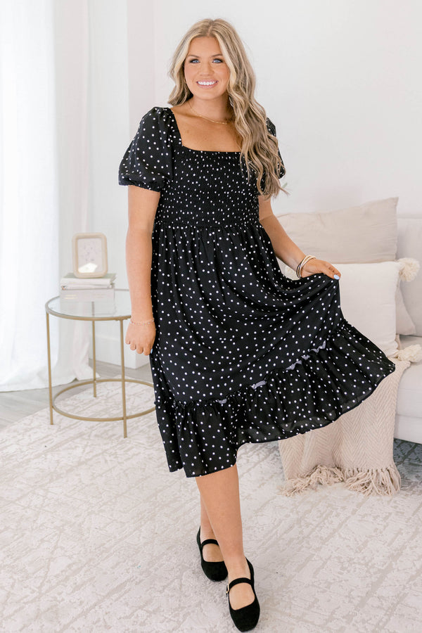 Chic Soul plus size clothing, black polka dot midi dress that has a square neckline and bubble sleeves as well as a ruddle detail on the bottom of the dress 