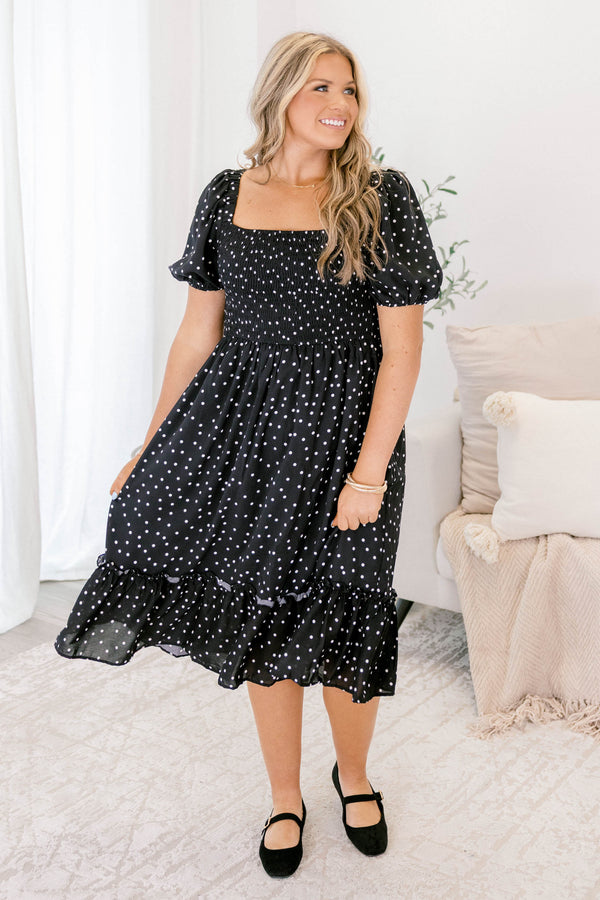 Chic Soul plus size clothing, black polka dot midi dress that has a square neckline and bubble sleeves as well as a ruddle detail on the bottom of the dress 