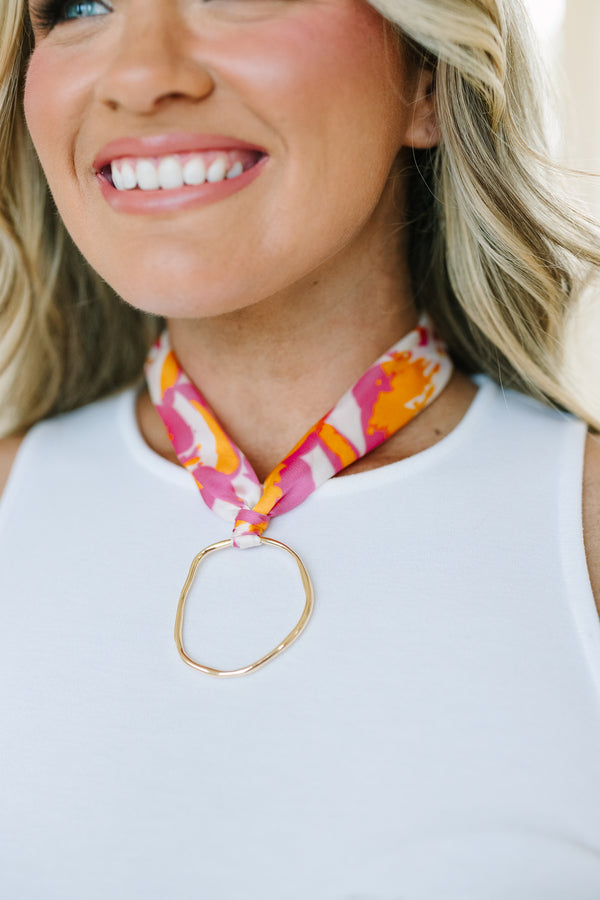 Plus Size pink and orange abstract floral print fabric scarf necklace with a gold ring pendant.