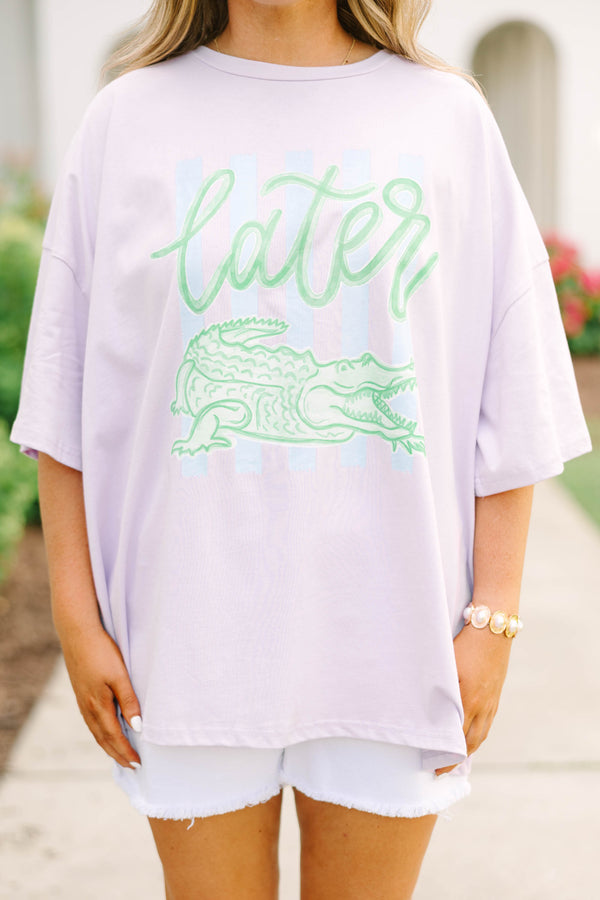 Plus Size lilac oversized boyfriend tee with a green alligator graphic and white denim shorts.