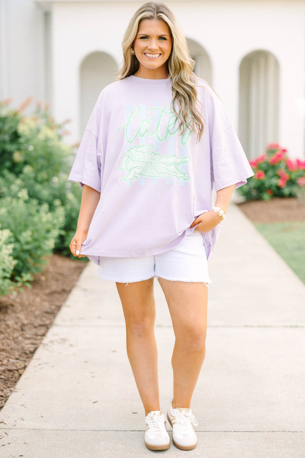 Plus Size lilac oversized boyfriend tee with a green alligator graphic and white denim shorts.