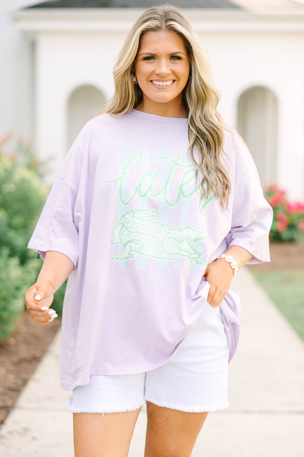 Plus Size lilac oversized boyfriend tee with a green alligator graphic and white denim shorts.
