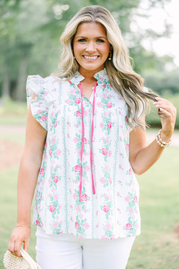 Plus Size white floral top with pink rose print, ruffle sleeves, and pink tie neckline.