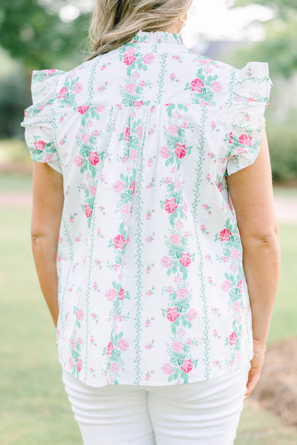 Plus Size white floral top with pink rose print, ruffle sleeves, and pink tie neckline.