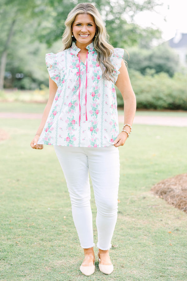 Plus Size white floral top with pink rose print, ruffle sleeves, and pink tie neckline.