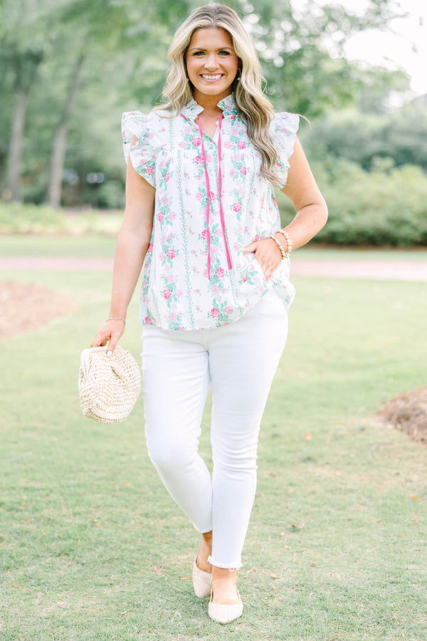 Plus Size white floral top with pink rose print, ruffle sleeves, and pink tie neckline.