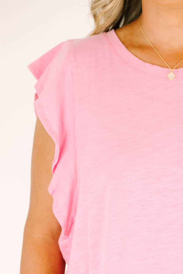 Plus Size light pink sleeveless top with ruffle shoulder details and blue denim frayed shorts.