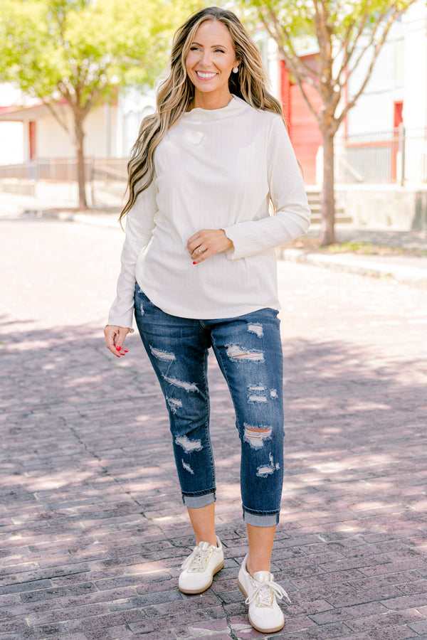 Chic Soul plus size clothing, dark wash jeans with distressed details and cuffs at the end of each pant leg 