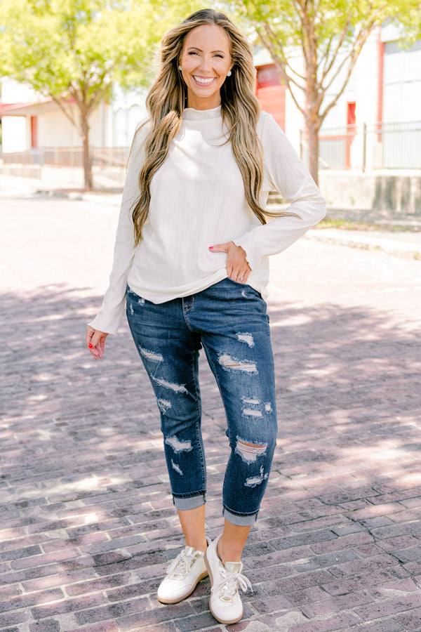 Chic Soul plus size clothing, dark wash jeans with distressed details and cuffs at the end of each pant leg 