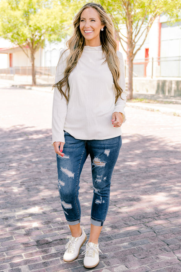 Chic Soul plus size clothing, dark wash jeans with distressed details and cuffs at the end of each pant leg 