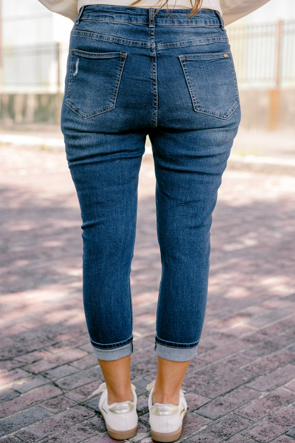 Chic Soul plus size clothing, dark wash jeans with distressed details and cuffs at the end of each pant leg 