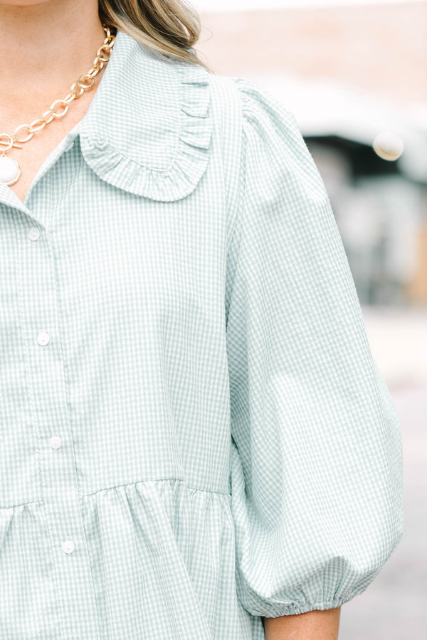 Plus Size green gingham babydoll dress with ruffled Peter Pan collar and puff sleeves.