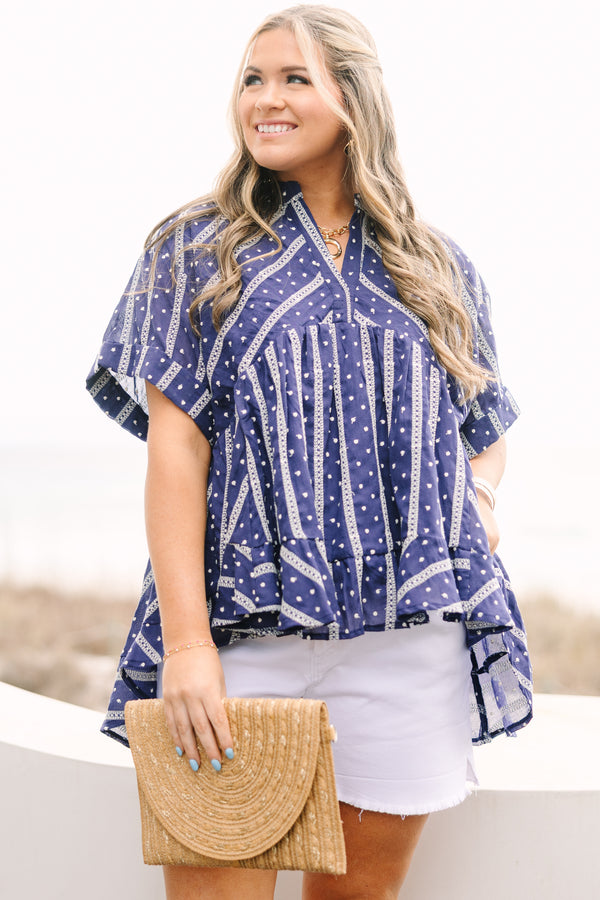 Chic Soul plus size clothing, navy short sleeve flowy top with white embroidered detailing pattern and v neck cutout and ruffle high low hem