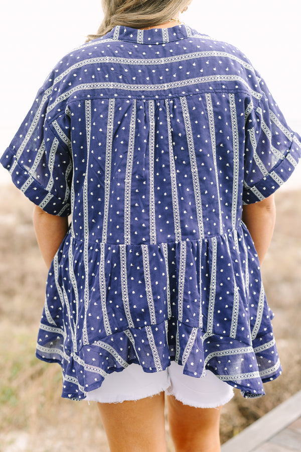 Chic Soul plus size clothing, navy short sleeve flowy top with white embroidered detailing pattern and v neck cutout and ruffle high low hem