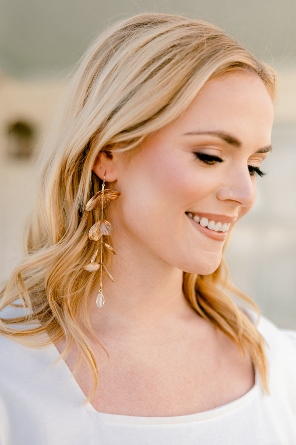 Chic Soul plus size clothing, gold drop dangle earrings with floral petal design with crystal on the bottom  