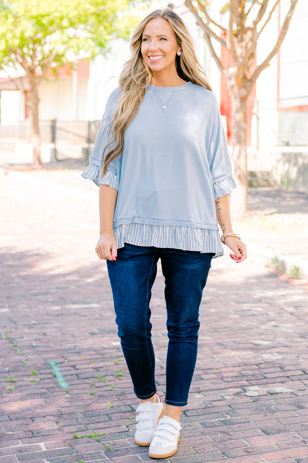 Chic Soul plus size clothing, blue top with half sleeves and a blue striped ruffle detail on the end of the sleeves and bottom of the shirt 