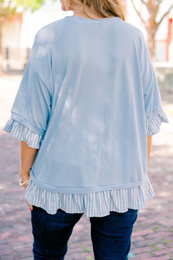 Chic Soul plus size clothing, blue top with half sleeves and a blue striped ruffle detail on the end of the sleeves and bottom of the shirt 