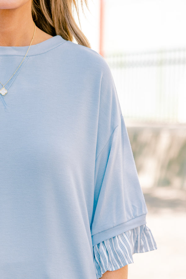 Chic Soul plus size clothing, blue top with half sleeves and a blue striped ruffle detail on the end of the sleeves and bottom of the shirt 