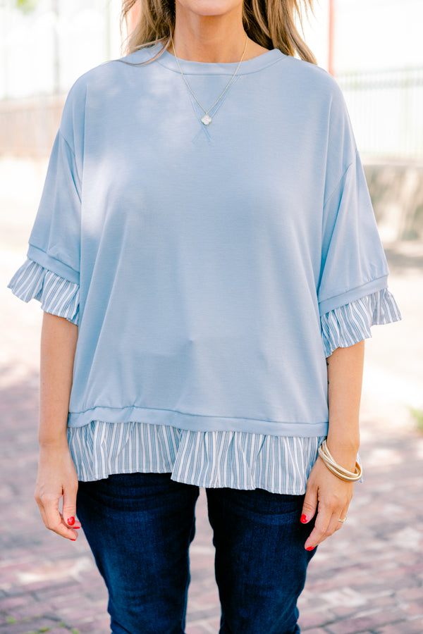 Chic Soul plus size clothing, blue top with half sleeves and a blue striped ruffle detail on the end of the sleeves and bottom of the shirt 