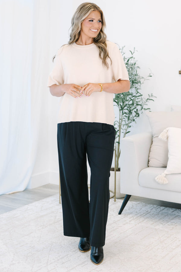 Plus size black wide-leg pants with a flowy fit and comfortable elastic waistband.