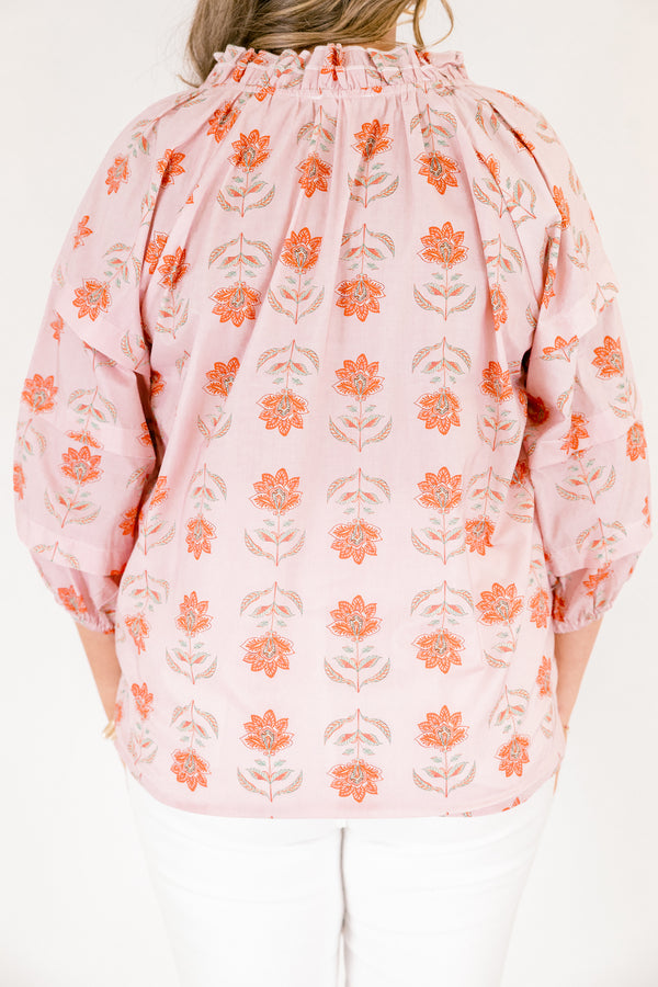 Chic Soul plus size clothing, pink top with half bubble sleeves and a slight v-neckline as well as a pink floral pattern throughout 