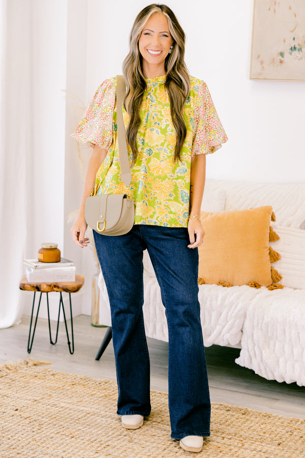 chic soul plus size clothing, green top with one abstract leafy pattern on shirt and a floral pattern on the bubble sleeves, high neck 