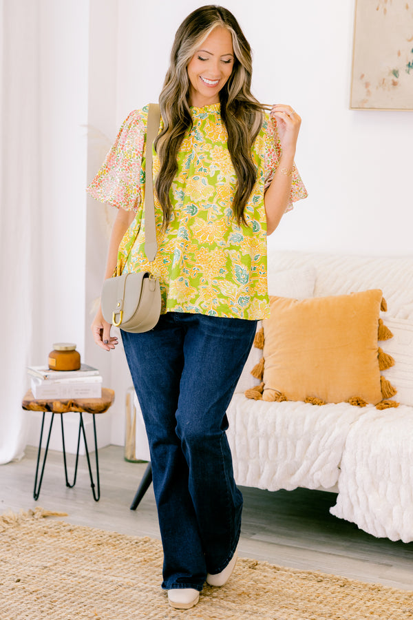chic soul plus size clothing, green top with one abstract leafy pattern on shirt and a floral pattern on the bubble sleeves, high neck 
