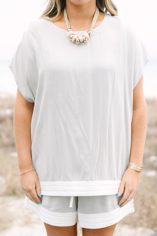 Chic Soul plus size clothing, taupe short sleeve casual top with a thick white ribbed stripe going along the bottom of the top 
