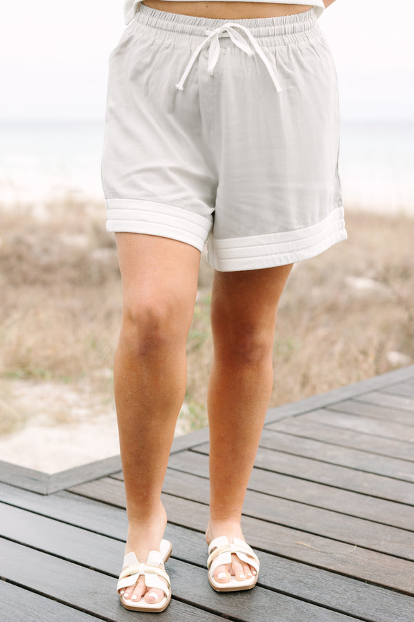 Chic Soul plus size clothing, taupe casual shorts with a thick white ribbed stripe going along the bottom of each short leg as well as a drawstring waist 
