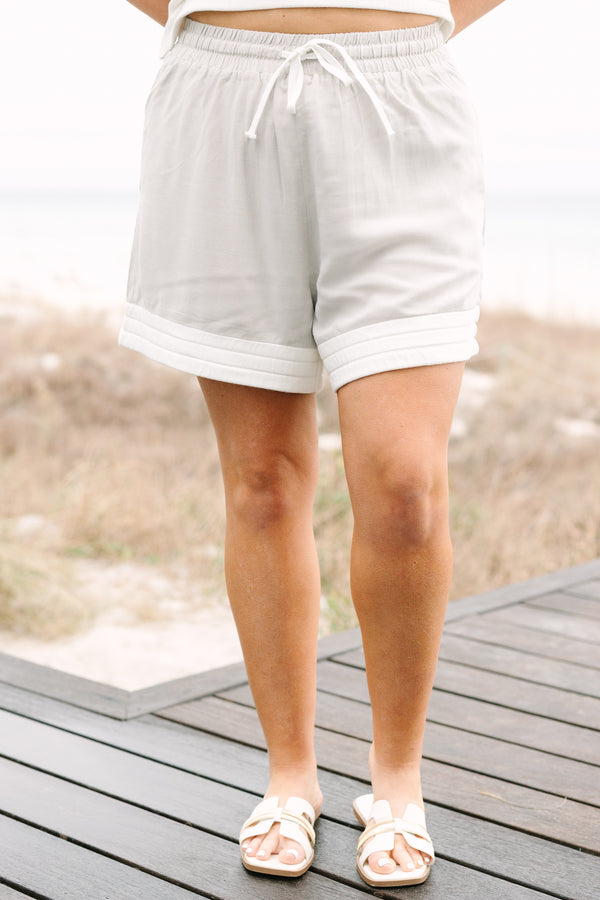 Chic Soul plus size clothing, taupe casual shorts with a thick white ribbed stripe going along the bottom of each short leg as well as a drawstring waist 
