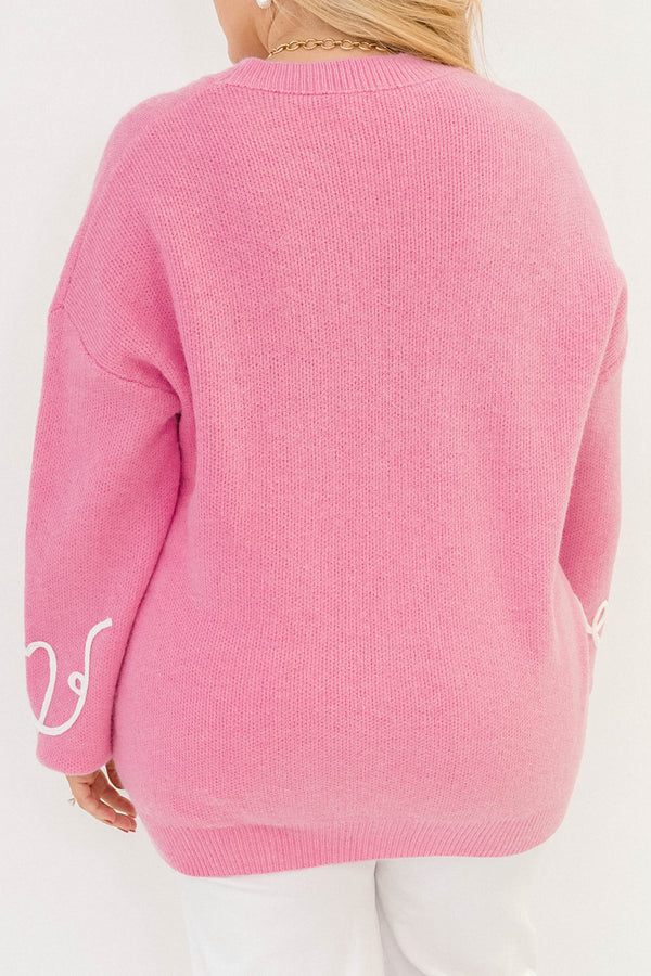 Chic Soul plus size clothing, pink long sleeve sweater with white heart details throughout the sweater 
