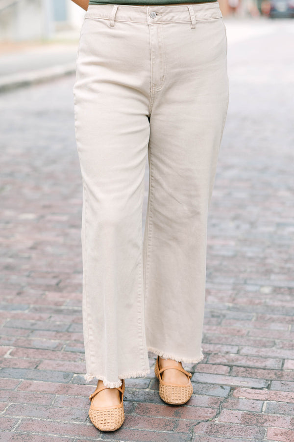 Plus Size ash mocha straight-leg jeans with a wide silhouette and frayed cutoff hem.