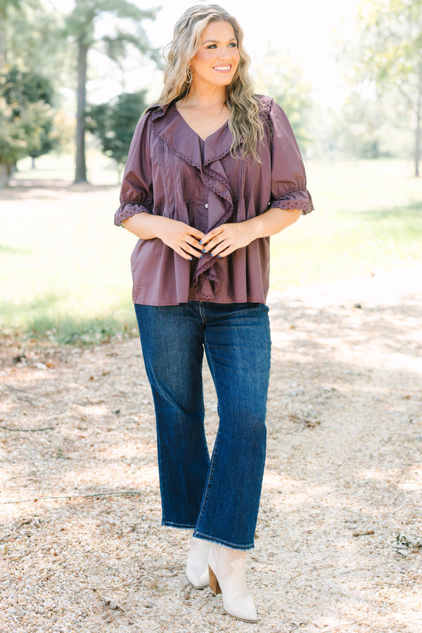 Plus Size brown top with ruffled V-neckline, eyelet trim, button front, and pleated bodice details.