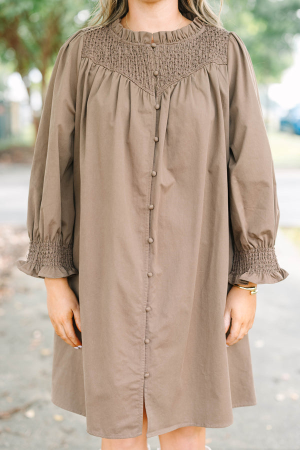 Plus size dress with smock detail, functional buttons down front and smocked long sleeves
