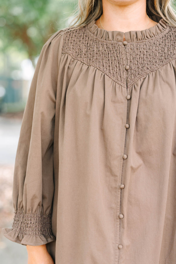 Plus size dress with smock detail, functional buttons down front and smocked long sleeves