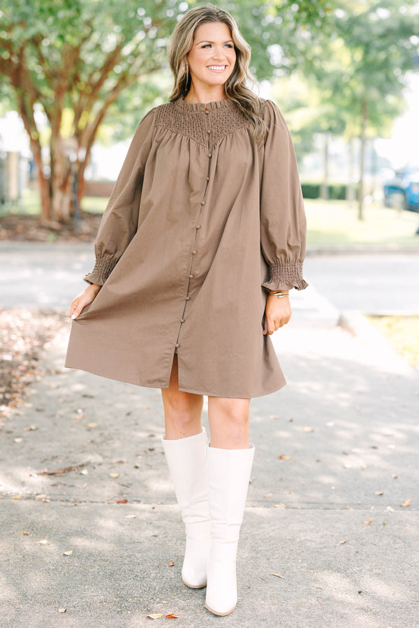 Plus size dress with smock detail, functional buttons down front and smocked long sleeves