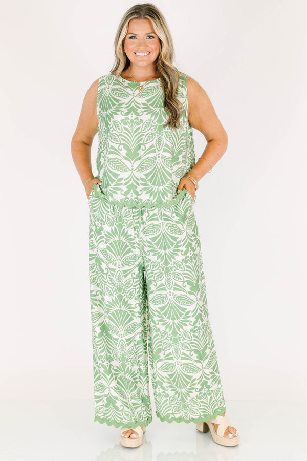 Chic Soul plus size clothing, green and white paisley patterned flowy pants with scalloped detailing along the bottom and an elastic waistband 