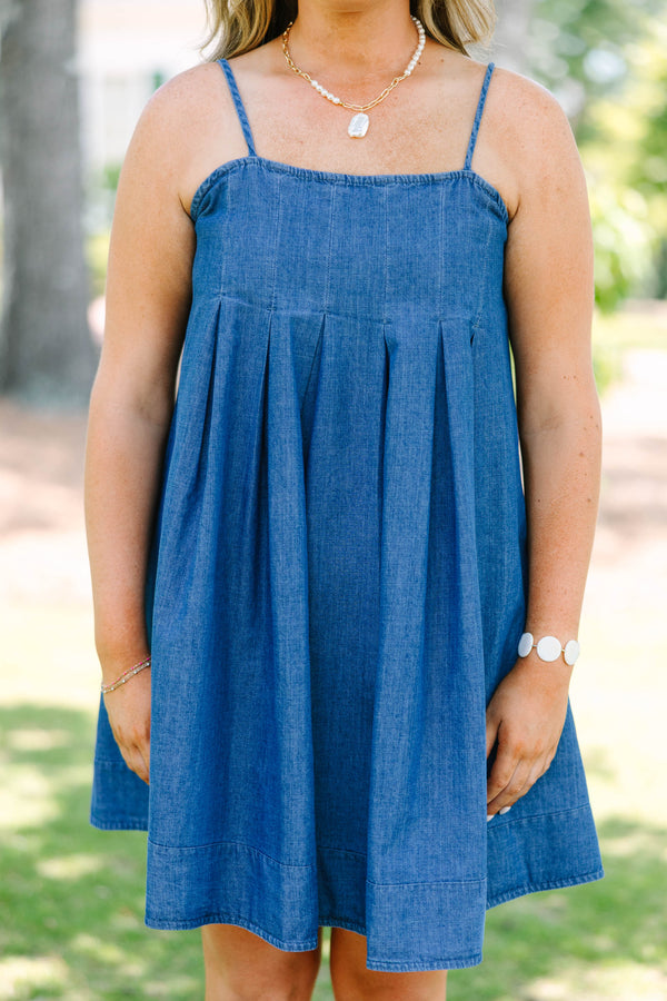 Plus Size denim mini dress with thin spaghetti straps, a square neckline, and a pleated skirt.