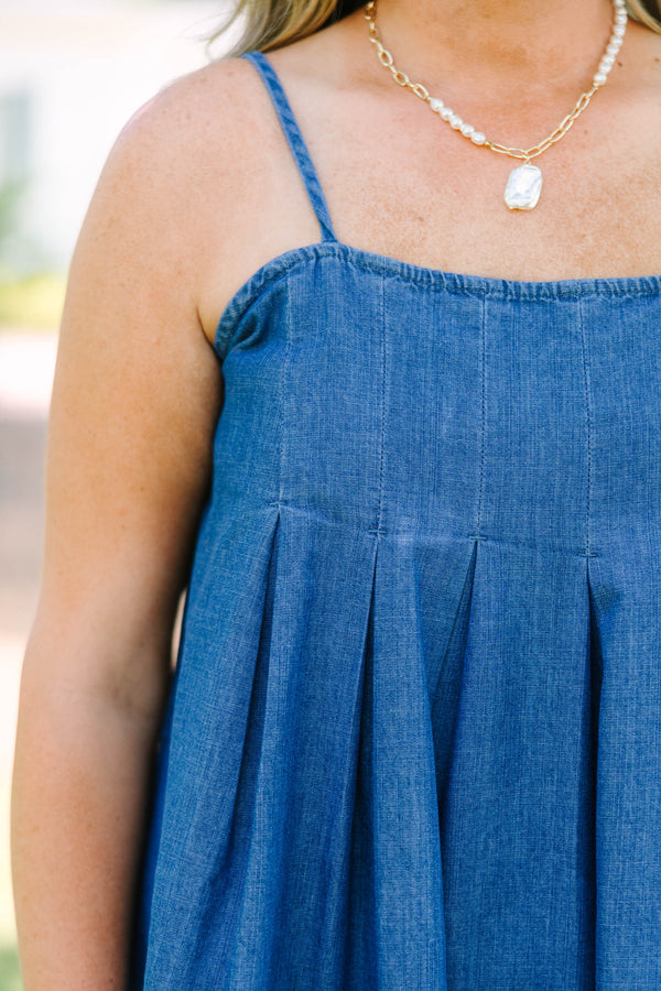 Plus Size denim mini dress with thin spaghetti straps, a square neckline, and a pleated skirt.