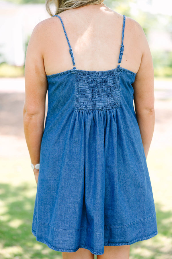 Plus Size denim mini dress with thin spaghetti straps, a square neckline, and a pleated skirt.