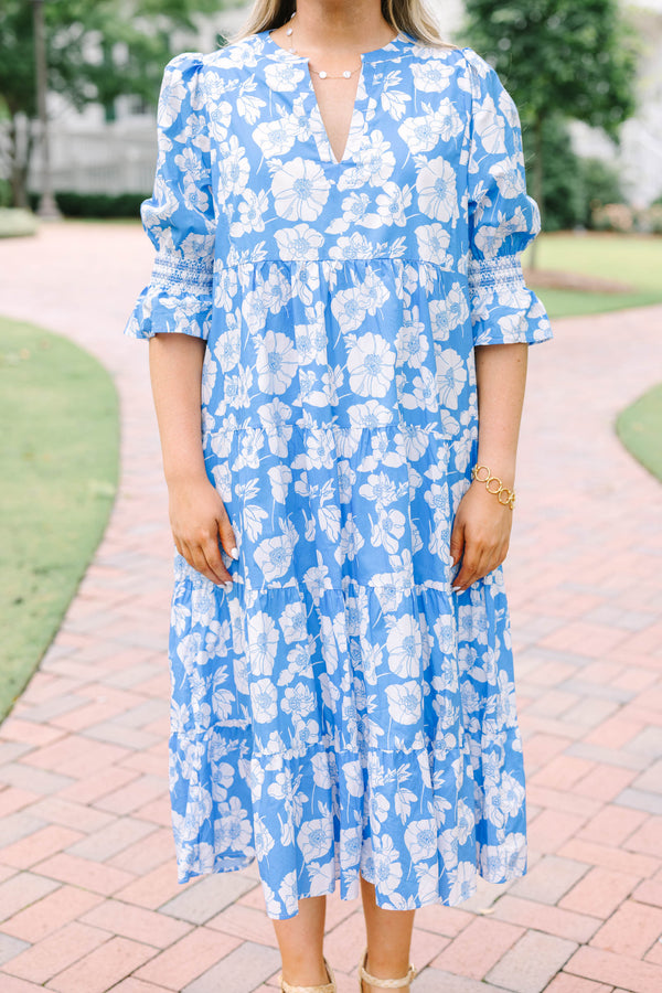 Plus Size blue and white floral tiered midi dress with puff sleeves and a V-neckline.