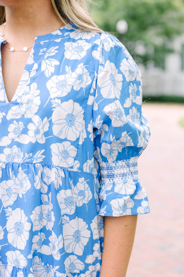 Plus Size blue and white floral tiered midi dress with puff sleeves and a V-neckline.